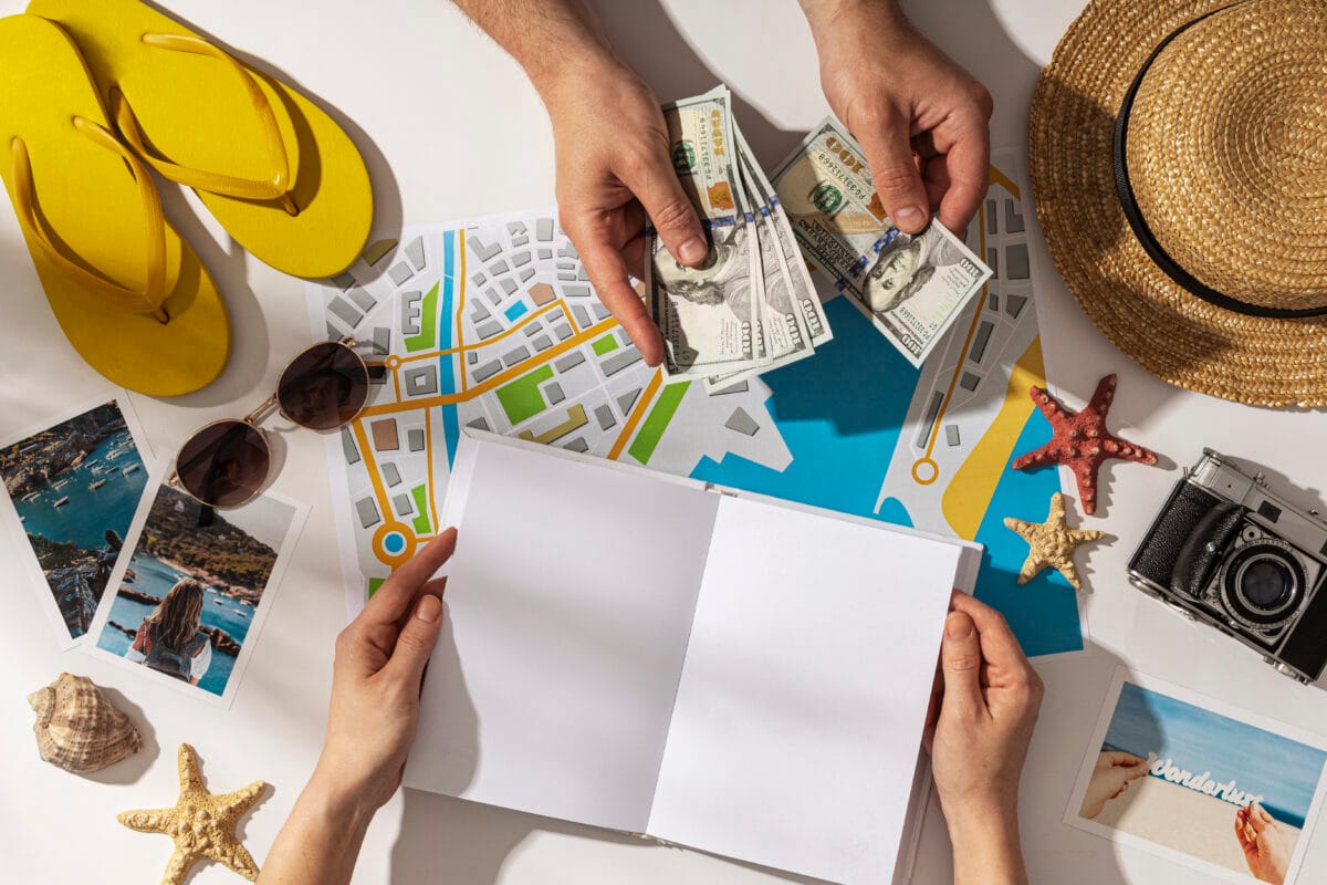 flat-lay-hands-holding-notebook-cash